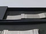 a watch that is in a box on the table