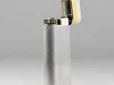 a close up of a lighter on a white surface with a gray background