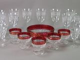 a lot of wine glasses that are sitting on a table