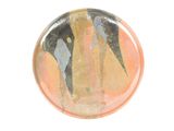 a picture of a glass button with a painting on it