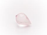 a pink quartz tear shaped stone on a white background