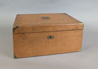 a small wooden box with a lock on it