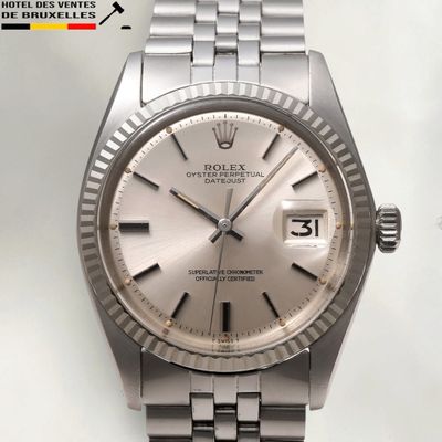 an image of a silver rolex watch on a white background