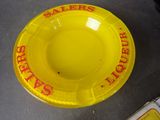 a yellow plastic bowl with a sale sign on it