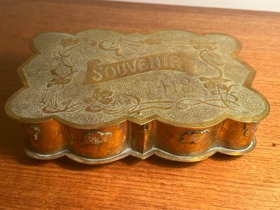 a small metal box that is sitting on a table