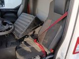 a seat in the driver ' s seat of a truck