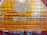 a close up of a red and yellow light on a motorcycle