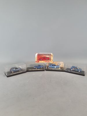 three toy cars are sitting on top of each other on a table