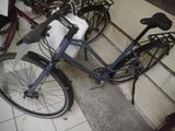 a bicycle that is parked next to a bunch of bikes