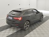 the rear end of a grey audi suv parked in a garage