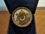 a close up of a medal in a case on a table