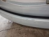 the front bumper of a car with a denting dent on it