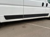 a white van that is parked in a parking lot