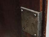 a close up of a wooden door with a metal latch