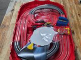 a red box with a hose and a blow dryer on it