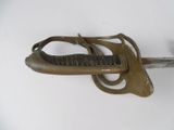 a very old sword that is on display on the wall