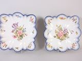 pair of vintage blue and white plates with flowers on them