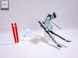 a figurine of a skier jumping in the air