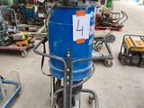 an image of a blue drum with a sign on it