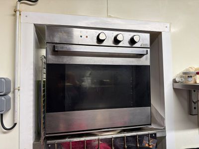 a stainless steel oven that is in a kitchen