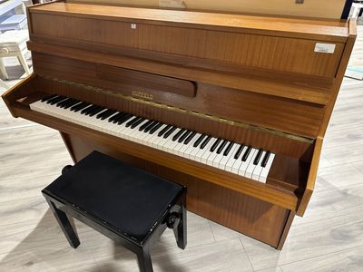 Piano droit d'occasion HUPFELD.