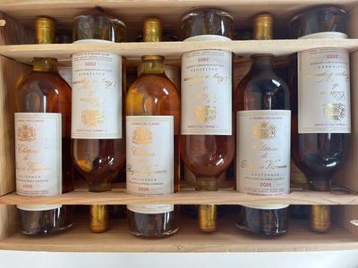 many bottles of wine sitting in a wooden box