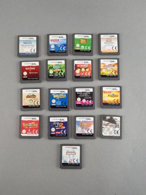 a lot of video game cards on the table