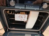 a sign on the door of an oven that is not in the oven