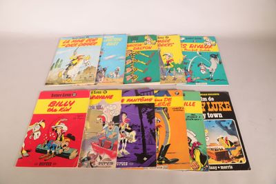 several children ' s books are lined up on a white surface