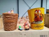 two buckets of food sitting on top of a cardboard box