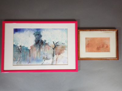 two framed pictures hanging on the wall above a bed