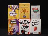 a lot of cereal boxes stacked on top of each other