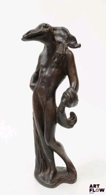 statue of a woman with a bird on her head and a bird on her shoulder