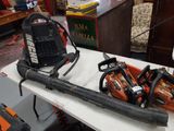 many chainsaws on a table in a room