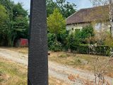 a tall stone obelisk in the middle of a field