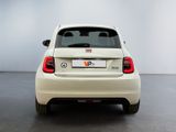 the rear end of a white car with a license plate on it