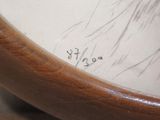 a picture of a close up of a clock with writing on it