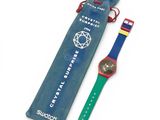 an image of a watch with a blue case and a green strap