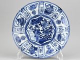 a blue and white plate with a circular design on it