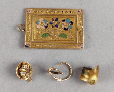 three pieces of gold and enamel jewelry including a ring, earring, and broochle