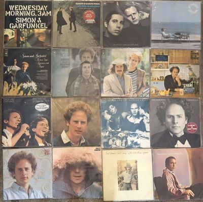 many different album covers on the floor of this room