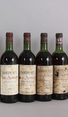 plusieurs bouteilles de vin sont alignées sur une table