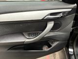 the interior of a car with the door open and the door handle open