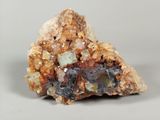 a piece of rock that has a lot of crystals on it