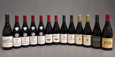 several bottles of wine are lined up in a row on a table