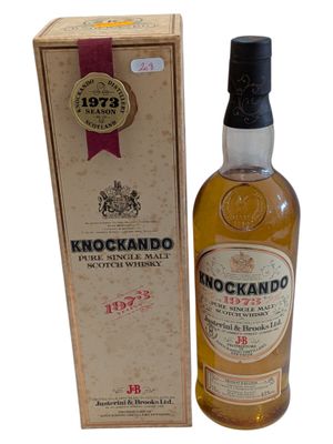 an image of a bottle of knockandoo whisky next to a box