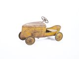 a small toy car with a steering on a white surface