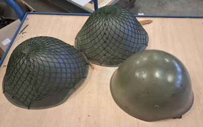 three helmets that are sitting on a table