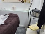 a bed in a room with a brown blanket on it