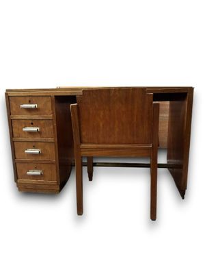 a desk with a chair and a desk top on it